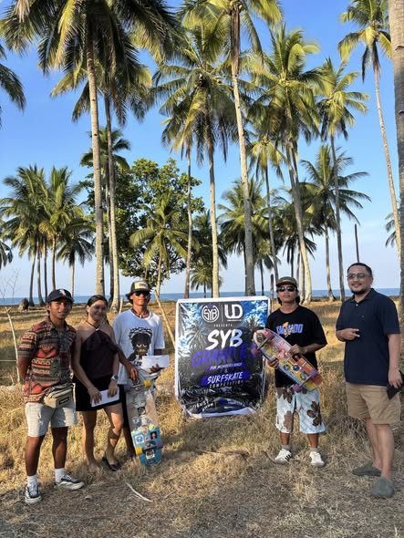 SYB × URBANDRIP surfskate competition — crew with the event banner